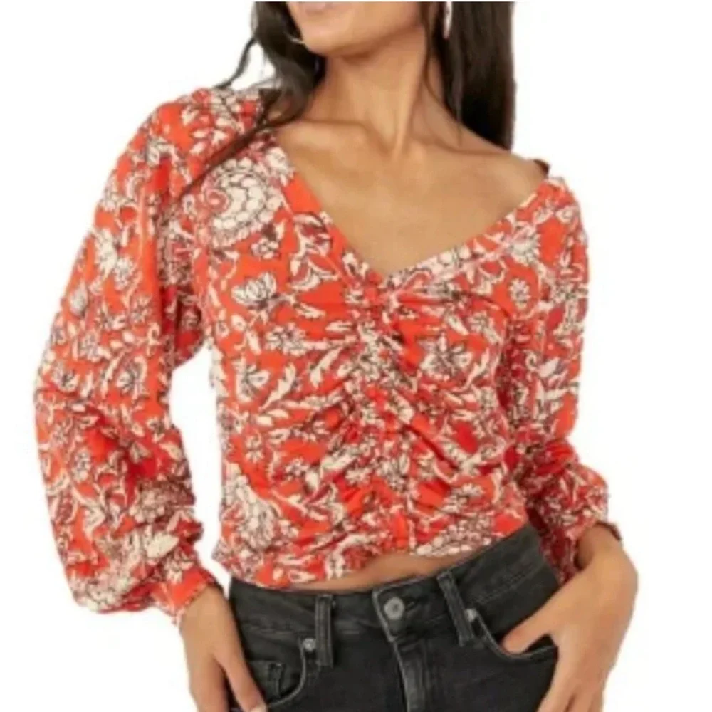 NWT FREE PEOPLE M Say the Word top with balloon sleeves in funky V neck style